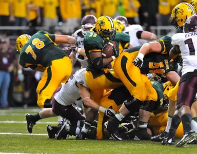 John Crockett (23) spins toward the end zone