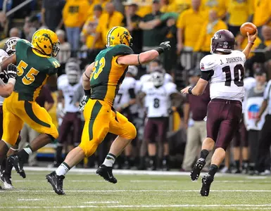Kyle Emanuel (53) and Alex Hahn (55) chase the quarterback