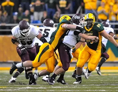 Kyle Emanuel (left) hits the quarterback