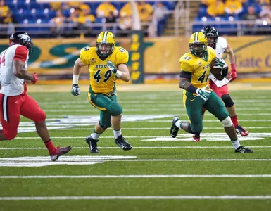 Nick DeLuca (49) blocks Pierre Gee-Tucker (47)