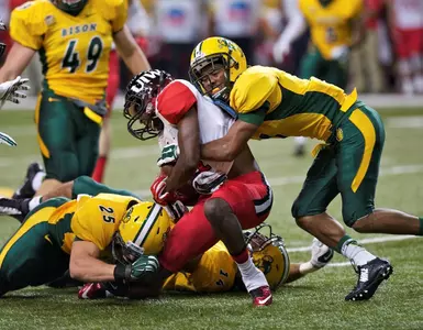Zach Colvin (7) and Chase Morlock (25) tackle