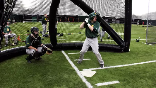 Live action on a full infield with portable pitching mound