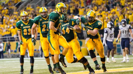 RJ Urzendowski celebrates with teammates after touchdown