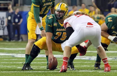 Easton Stick, Zack Johnson and Austin Kuhnert pre-snap
