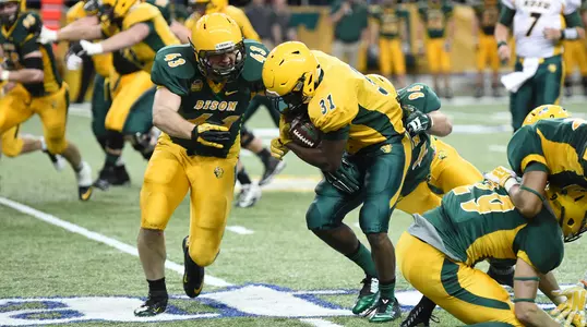 Kurt Mattox (43) tackles Ty Brooks (31)