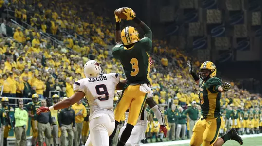 Tre Dempsey (3) intercepts a pass in the end zone