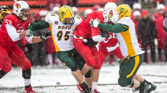 NDSU's Caleb Butler and Aaron Steidl make a tackle in the snow