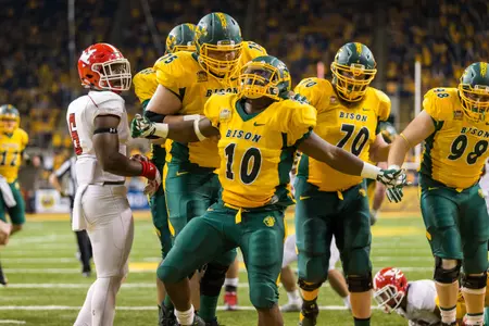 Austin Kuhnert (75) and Lance Dunn (10) celebrate a TD