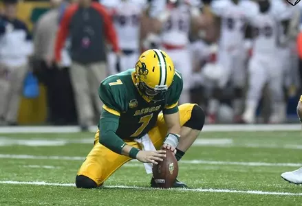 Cole Davis (7) holds for kicker Ben LeCompte (19)