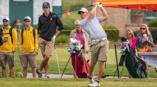 Lucas Johnson swings a golf club