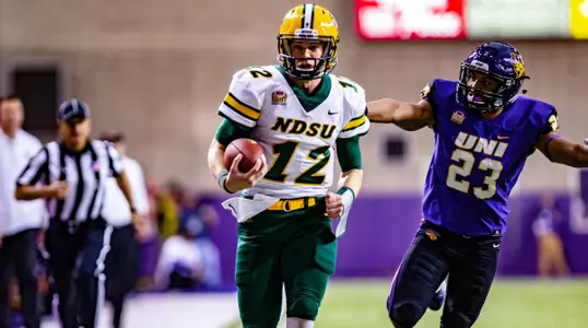 Easton Stick rushes for a touchdown past a UNI defender