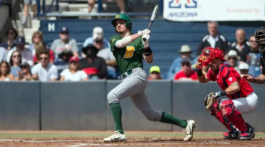 North Dakota State University Bison catcher Sean Noel (15) follows through on his swing during a game against the University of Arizona Wildcats at Hi Corbett Field on March 11, 2018 in Tucson, Arizona. (Zachary Lucy Photography)