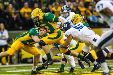 Easton Stick rushes through tacklers