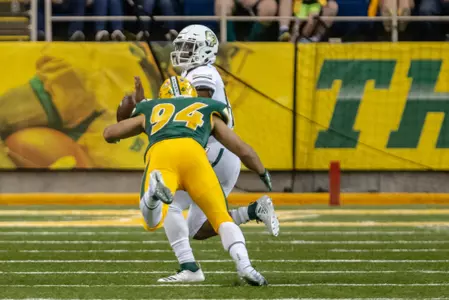 Stanley Jones tackles the Cal Poly quarterback