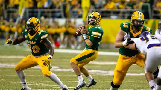 Lance Dunn and Zack Johnson block for NDSU quarterback Easton Stick