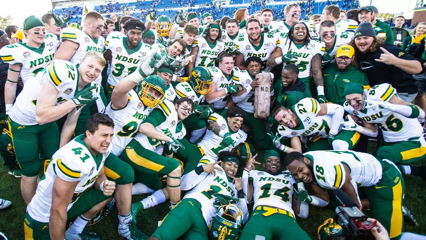 NDSU celebrates with the Dakota Marker trophy