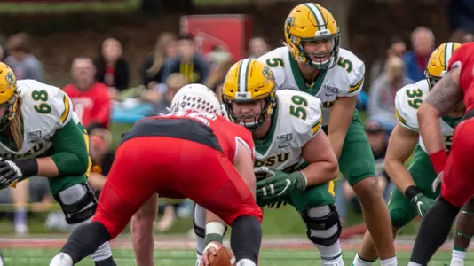 NDSU quarterback Trey Lance behind center Karson Schoening