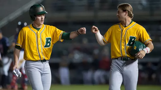 North Dakota State University Bison teammates Jake Malec (19) and Nick Emanuel (20) congratulate each other during a pitching change in a game against the University of Arizona Wildcats at Hi Corbett Field on March 9, 2018 in Tucson, Arizona. (Zachary Lucy Photography)