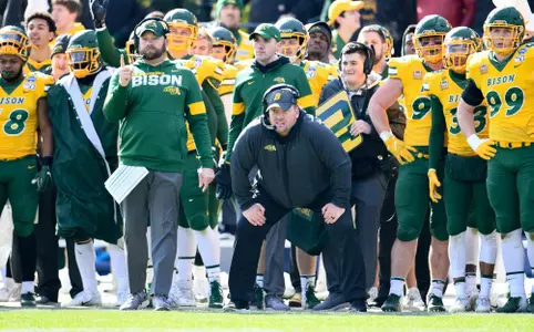 NDSU head coach Matt Entz and the Bison football team watch from the sideline