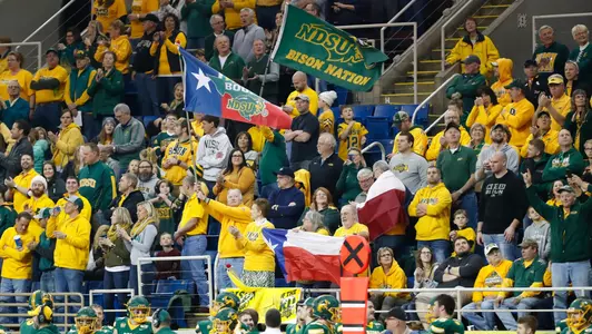 NDSU football fans wave flags