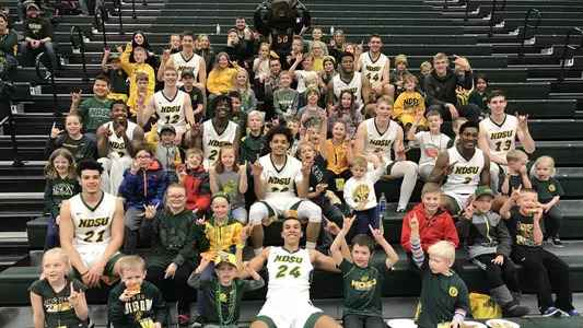 Junior Bison Club members with NDSU men's basketball players