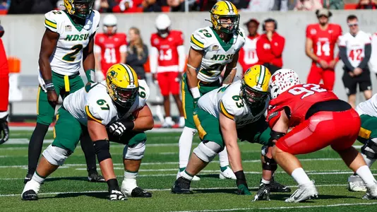 NDSU football players Cordell Volson, Jake Kubas, Quincy Patterson and Dominic Gonnella lined up for a snap.