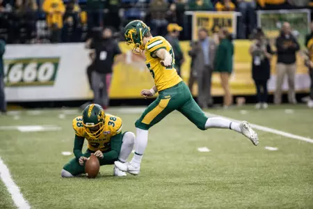 Garret Wegner holds for Will Cardinal