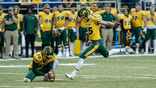 Garret Wegner holds for Will Cardinal