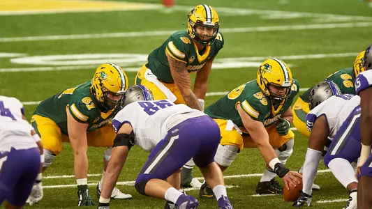 QB Trey Lance behind linemen Zach Kubas, Karson Schoening