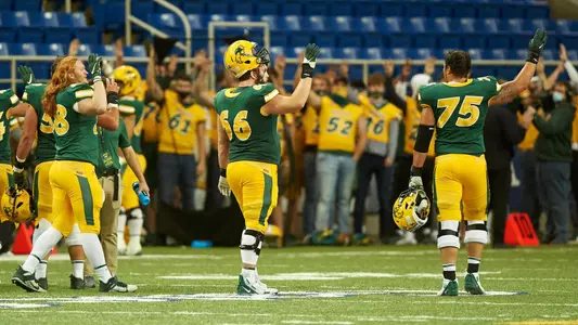 Nash Jensen holds up four fingers