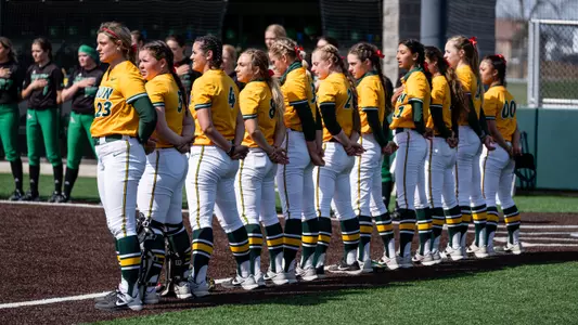 NDSU softball team lined up for the national anthem