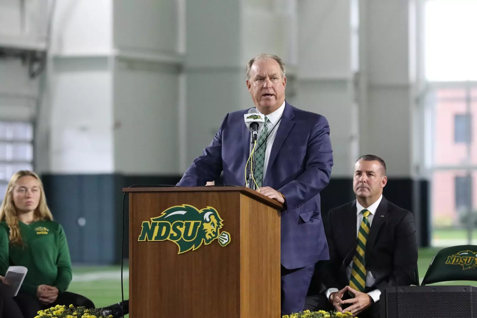 Jim Alexander of Nodak Insurance Company speaks at the ribbon cutting ceremony for the Nodak Insurance Football Performance Complex.