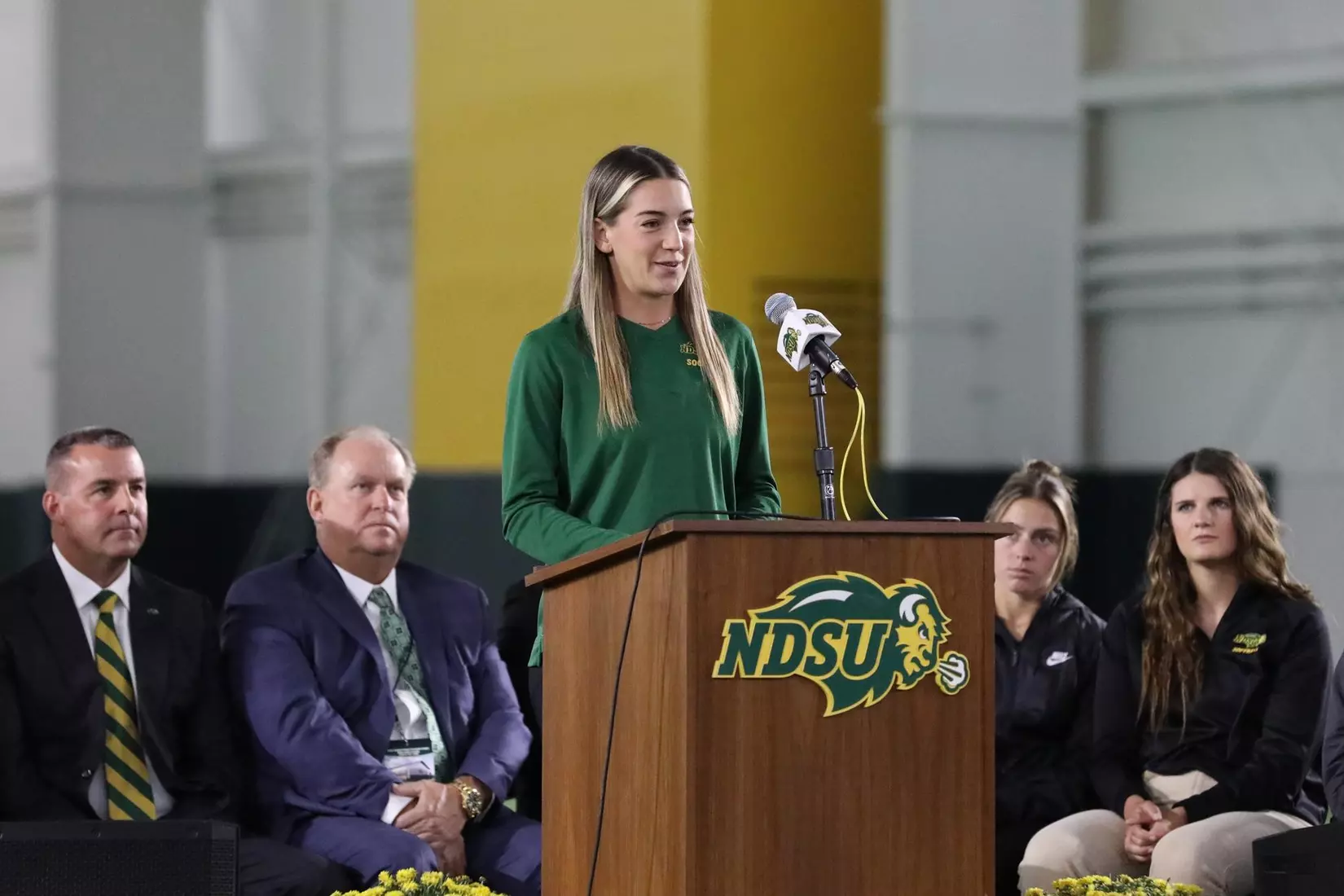 Paige Goaley of the NDSU women's soccer team speaks at the ribbon cutting ceremony for the Nodak Insurance Football Performance Complex.