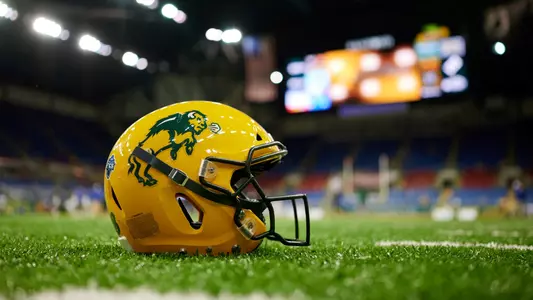 NDSU football helmet on Fargodome turf