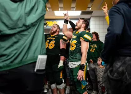 James Kaczor (26) and the Bison celebrate after the win over Samford