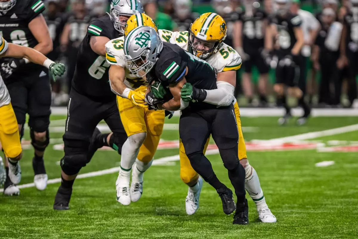 Jake Kava and Logan Kopp make a tackle