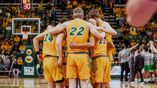 NDSU men's basketball team huddle