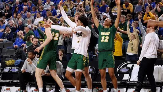 NDSU MBB team bench celebrates