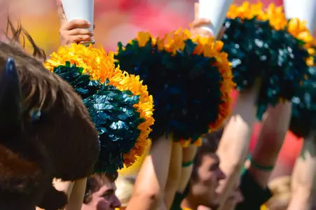 NDSU cheer team poms