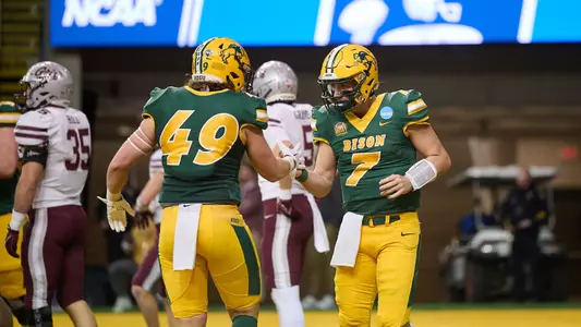 Cam Miller and Hunter Brozio shake hands