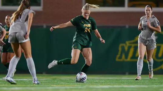 Loretta Wacek passing the ball