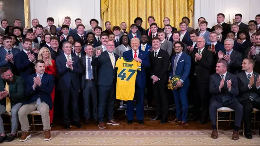 President Donald Trump poses for a photo with the North Dakota State University Bison football team, Wednesday, April 9, 2025, in the East Room of the White House. (Official White House Photo by Molly Riley)