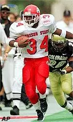 Senior running back Jaime Kimbrough eludes the Colorado defense.<br>