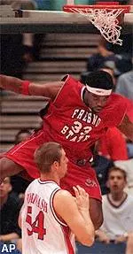 Fresno State's Melvin Ely looks down after dunking in front of SMU's Jon Forinash.