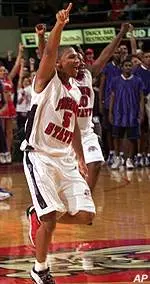 Demetrius Porter celebrates with his teammates after beating Tulsa at Selland Arena, in Fresno, Calif.