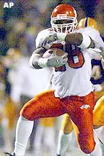 James Tillman pulls Texas-El Paso defensive back D.J. Walker for extra yardage during a first-quarter carry on Saturday.