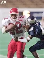 Fresno State's Josh Levi tries to break free from Rice defender Greg Gatlin.