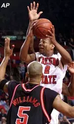 Fresno State's Tito Maddox drives by Georgia's Ezra Williams during the first half at Selland Arena.