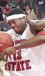 Fresno State's Melvin Ely, left, takes contact from South Carolina State's Dexter Hall (23) while going to the basket in the first half at Selland Arena, Thursday, Dec. 28, 2000, in Fresno, Calif. (AP Photo/The Fresno Bee, Craig Kohlruss)