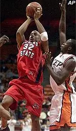 Courtney Alexander lofts a running jump shot over Texas-El Paso defenders in Saturday night's game.